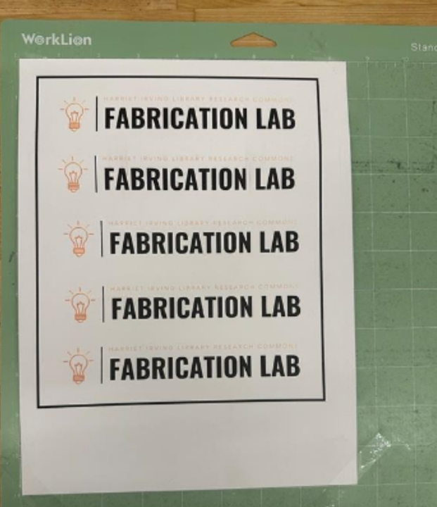 Image showing printed stickers on adhesion mat with transparent tape