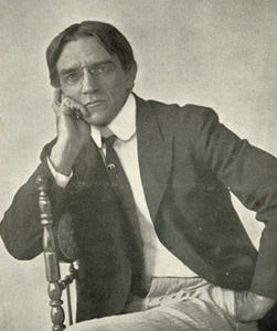 Charles GD Roberts relaxing in a chair