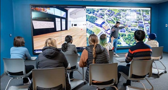 Data visualization wall consisting of a 3 by 5 grid of  55-inch 1080p Planar monitors