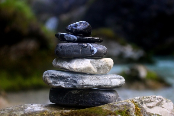 Stacked stones balancing by water