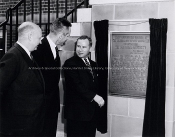 Photo taken in front of Thomas Carleton Hall, UNB, during unveiling for the plaque that commemorates the government's first legislation of UNB. PR; Series 1; Sub-series 1; Item 4681.