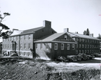 Side view and parking lot of Carleton Hall, [between 1960 and 1961]. UA PC 9 no. 39 (7). Photo credit: Harvey Studios Ltd.