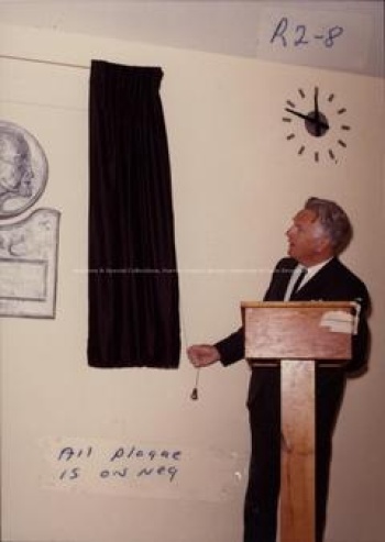 Robert H. Wright unveiling the plaque during the ceremony naming the Chemistry Building F.J. Toole Hall. Record group/Fonds PR; Series 1; Sub-series 2; Item 5140 May 1973.