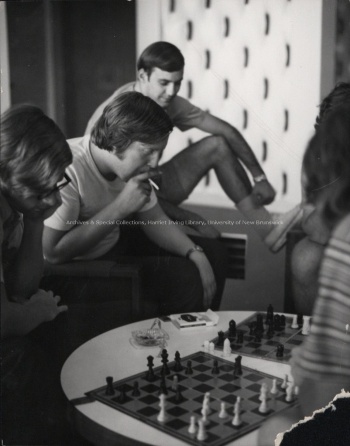 Students playing chess in the Student Union Building, (19--). PR; Series 1; Sub-series 2; Item 5557.