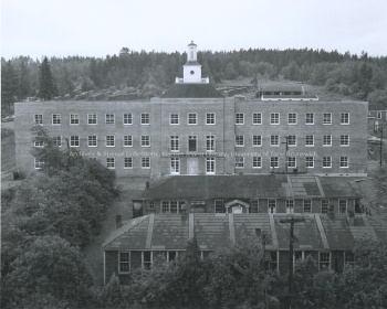 Toole Hall with huts in the foreground. UA PC 9 no. 40 (15).