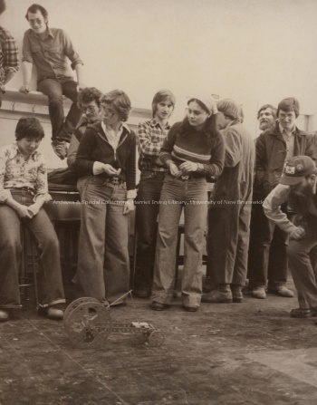 Mechanical Engineering students watching a small robot.Record group/Fonds PR; Series 1; Sub-series 4; Item 6427[19--].