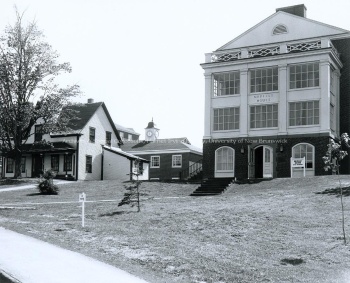 Neville House standing beside original Neville Homestead, [196-]. UA PC 9 no. 51 (9).Neville house.jpg