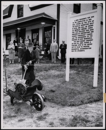 Fred Neville turning sod for construction of Neville House, 1960. UA PC-4 no. 8x