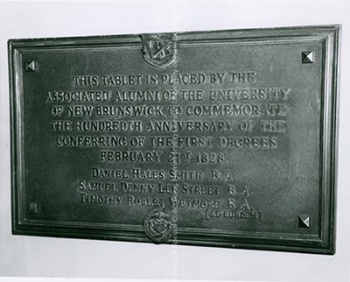 Plaque to commemorate the 100th anniversary of the conferring of the first degrees at UNB, 1967. PR; Series 2; Sub-series 3; File 721. Item 19.