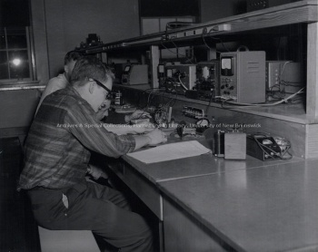 Two of students working in a lab in the Physics Department. Record group/Fonds PR; Series 1; Sub-series 1; Item 4762 1962.