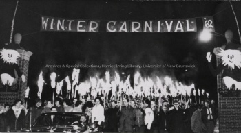 Winter Carnival torch-light parade exiting the MacLaren Gates, 1962. PR; Series 1; Sub-series 2; Item 5199.